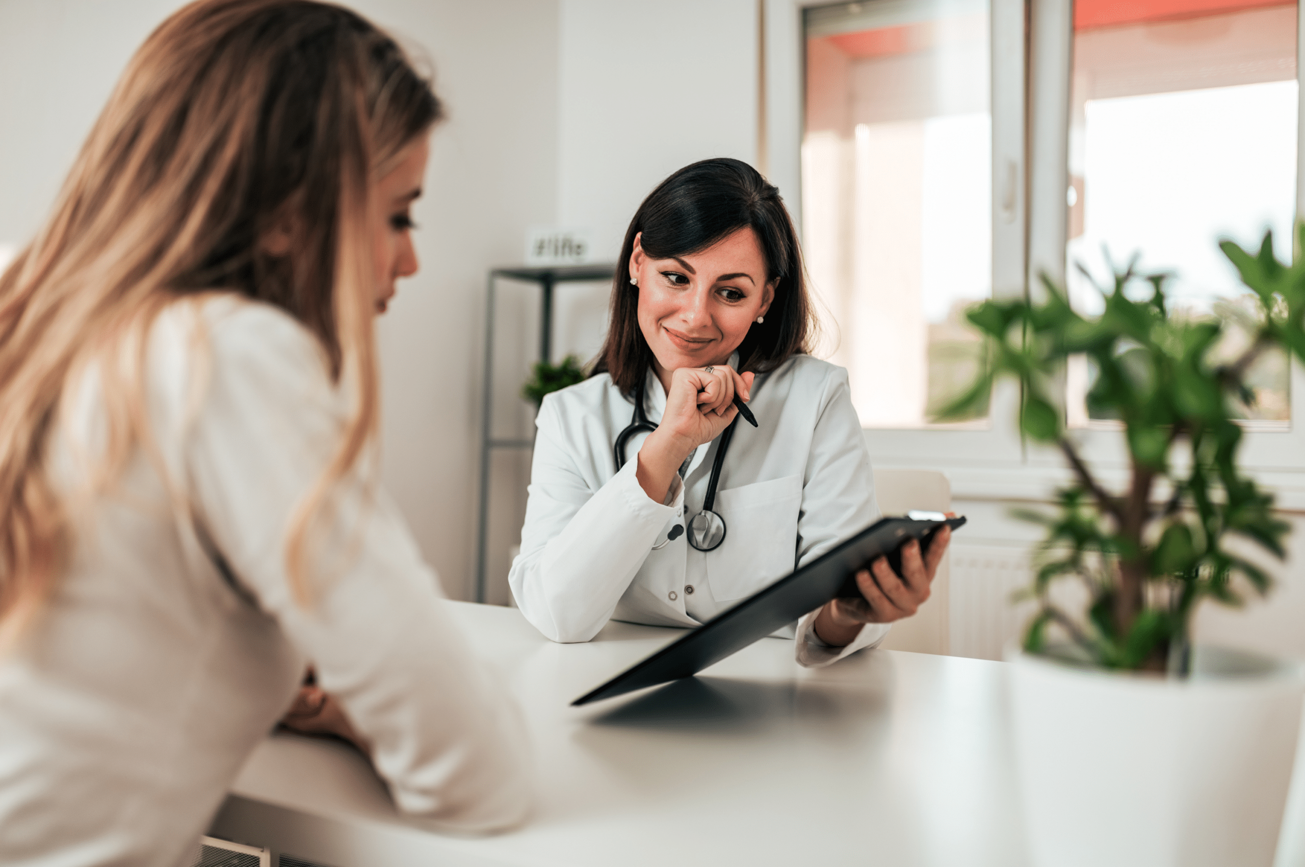 Woman consulting her doctor about suboxone and learning why suboxone is effective for Opioid Use Disorder recovery